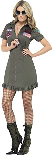 Woman wearing a green military-style dress with patches, fishnet tights, and boots.