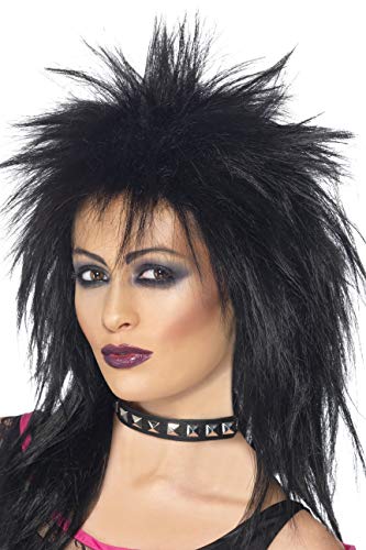 Black wig on mannequin head with choker and heavy eye makeup on white background.