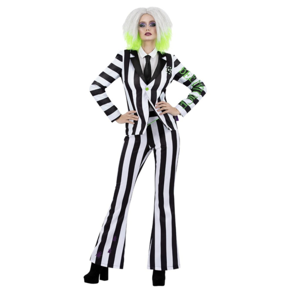 Woman in a black and white striped Beetlejuice costume with white wig.