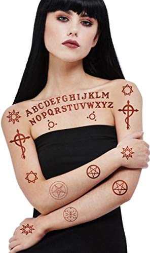 A woman with black hair wearing temporary occult and alphabet tattoo transfers on her skin.