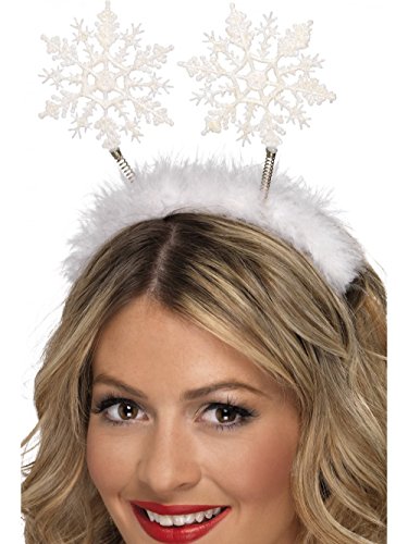 White snowflake boppers on a headband, worn by a person with brown hair.