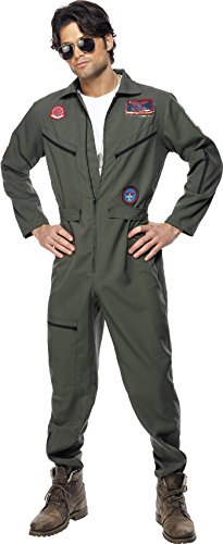 Man wearing a green flight suit with patches, sunglasses, and brown boots, posing confidently.