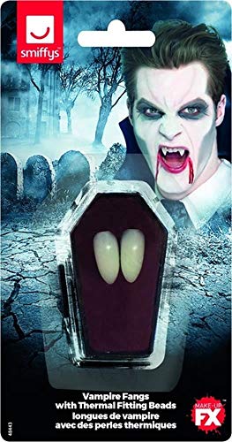 Plastic vampire fangs in coffin-shaped packaging, with a costumed model.