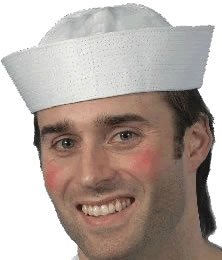 A man wearing a white sailor hat and white t-shirt against a white background.