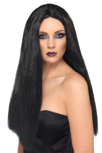 A woman wearing a black, straight, long-haired wig and a black strapless top.
