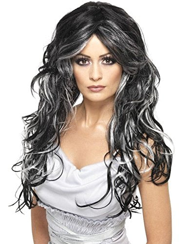 A woman wearing a long, curly black and silver wig and a white dress.
