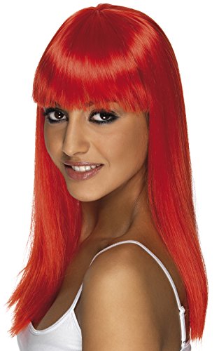 Woman wearing a bright red, straight, long wig with bangs, looking over her shoulder.