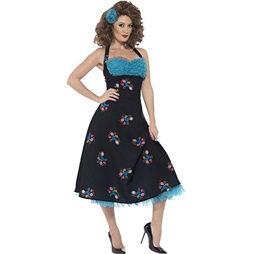 Woman wearing a black 1950s-style halter dress with blue ruffles and floral patterns.