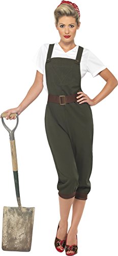 Woman wearing green WW2 Land Girl costume, holding a shovel, against a white background.
