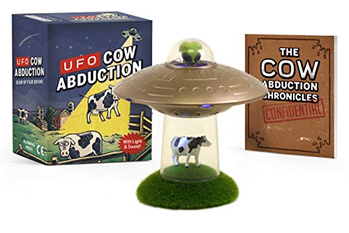 Small figurine of a cow with UFO and beam of light, on colorful base.