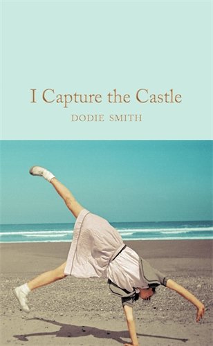 Book cover showing a girl doing a cartwheel on a beach under a blue sky.