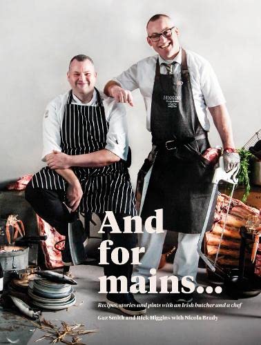 Cookbook cover featuring two men in aprons with meat in the background.