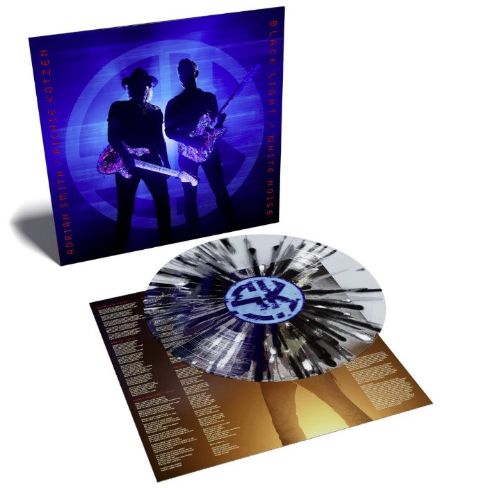 Album cover featuring two musicians with guitars against a splatter background.