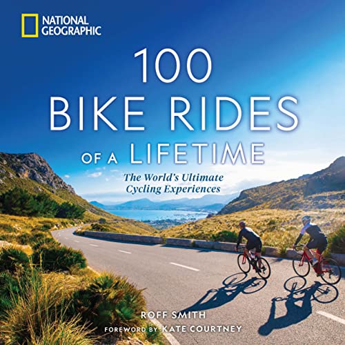 Book cover showing two cyclists riding on a scenic coastal road under blue skies.
