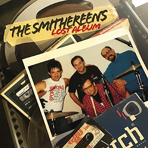 Album cover featuring a photo of The Smithereens band members surrounded by vintage tapes.