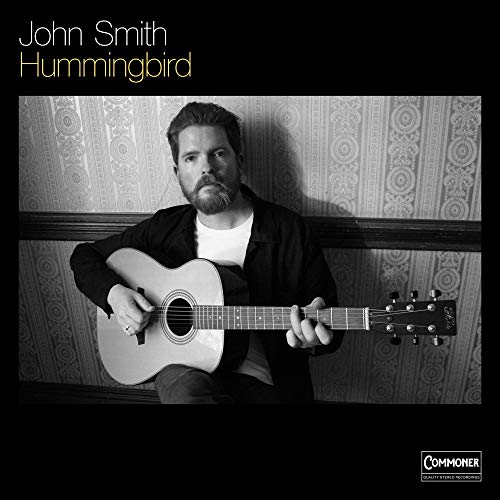 Black and white album cover featuring John Smith with an acoustic guitar.