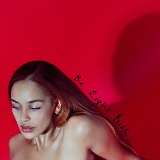 Red album cover featuring a portrait of a woman with closed eyes.