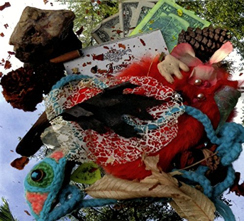 CD cover with bizarre assemblage of objects, including a doll and money.