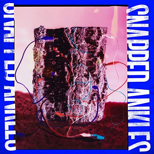 CD cover: textured purple block with colorful wires, pink background.