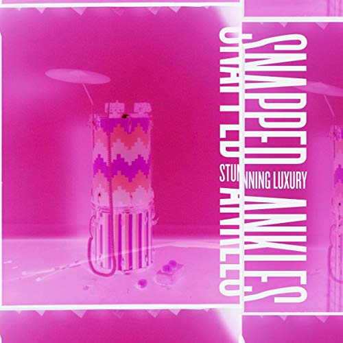 Pink album cover featuring a patterned tower and text “Snapped Ankles”.