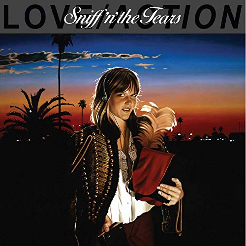 Album cover for Sniff 'n' The Tears, featuring a woman with headphones.