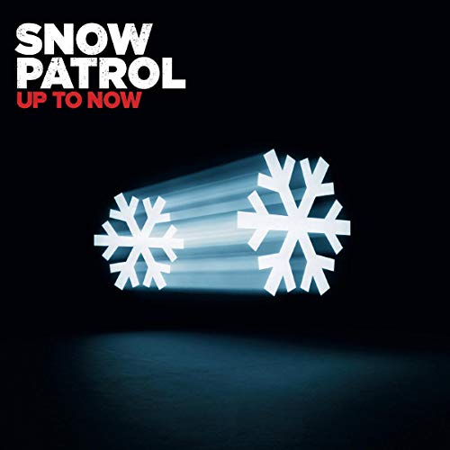 Snow Patrol album “Up To Now” cover with snowflakes and light beams.