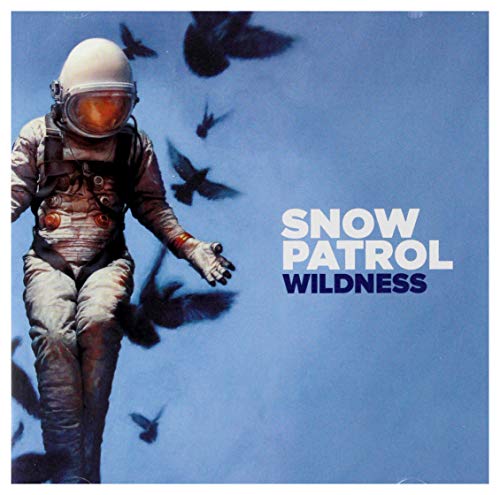 Snow Patrol’s “Wildness” CD cover: astronaut figure with flying birds.