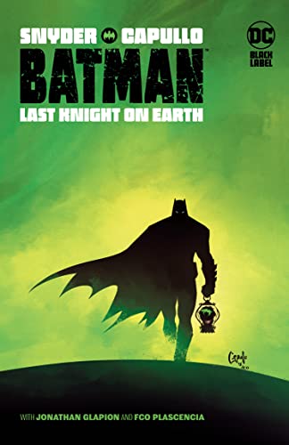 Batman stands silhouetted against a green and black landscape, holding a lantern.
