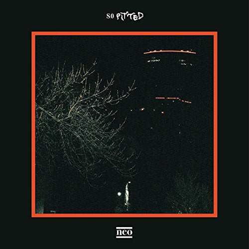 Cassette cover with a dark, grainy image of bare branches and red lights.