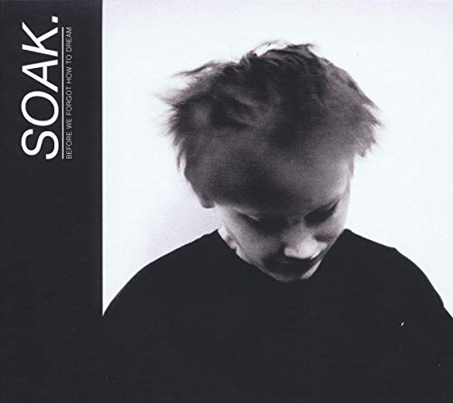 Black and white album cover featuring a young person with messy hair.