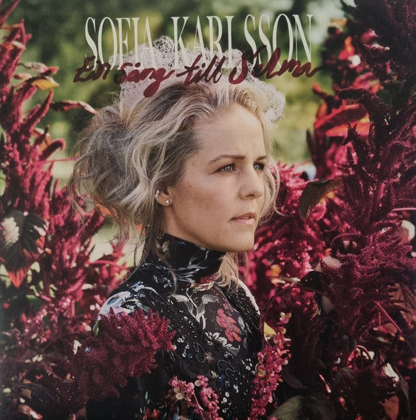 Album cover featuring Sofia Karlsson surrounded by dark red flowers.