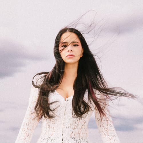 Woman with long dark hair against a cloudy, textured background.
