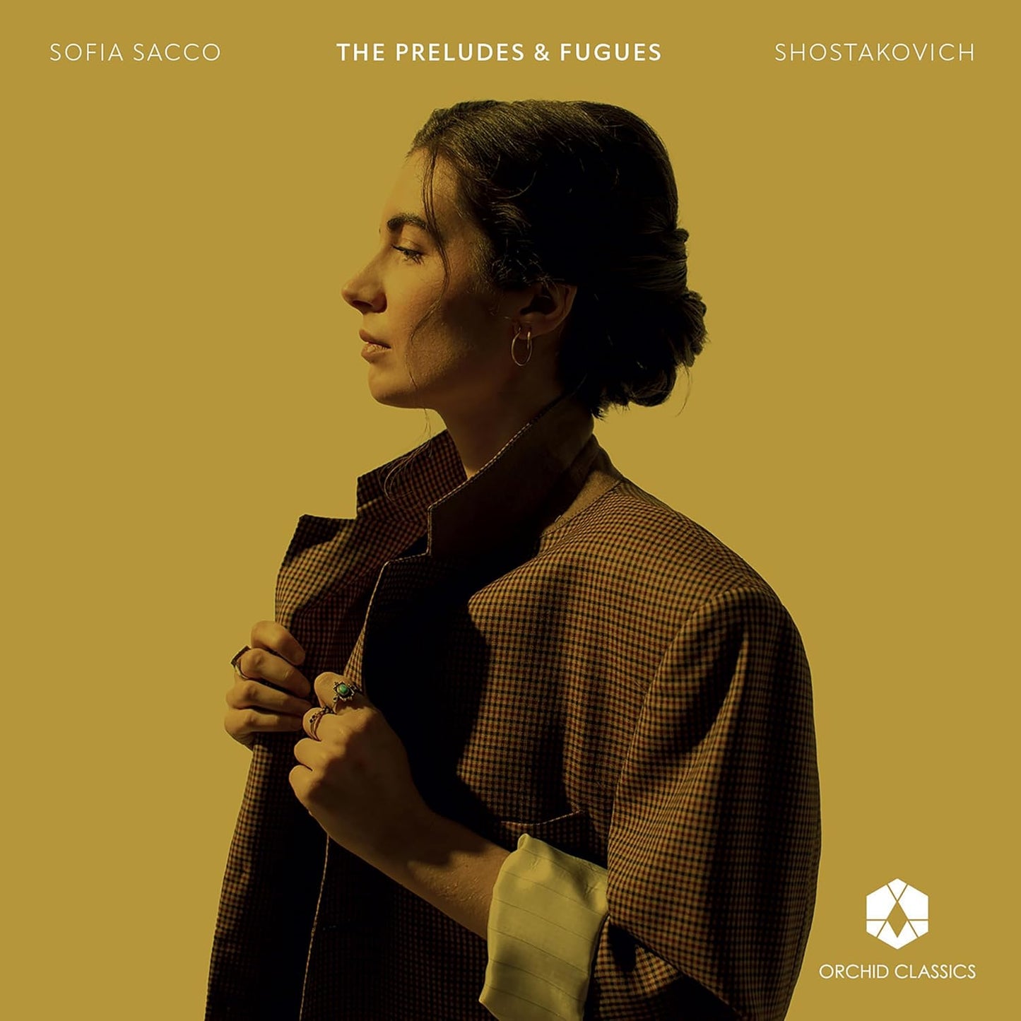 Sofia Sacco album cover: portrait of a woman in a checkered jacket.
