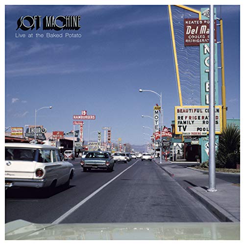 "CD cover with a 1970s-style road scene and motel sign, titled 'Soft Machine'."