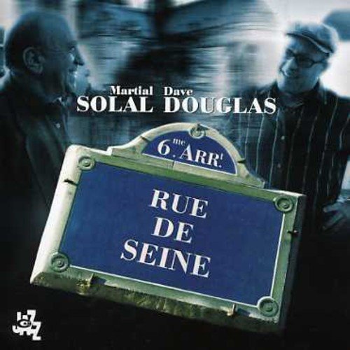 CD cover featuring two men and a Parisian street sign.