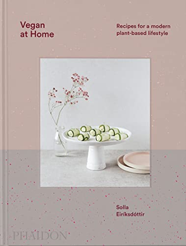 Cookbook cover featuring sliced cucumbers and a floral arrangement.