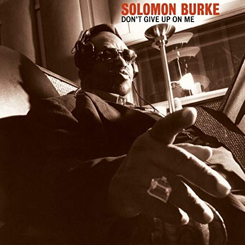 Solomon Burke album cover, sepia tone, man with headphones and microphone.