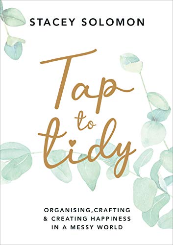 Book cover with gold cursive title "Tap to tidy" and eucalyptus leaves.