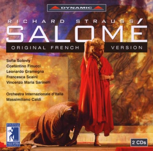 "CD cover featuring a woman in red, kneeling man, and fiery background."
