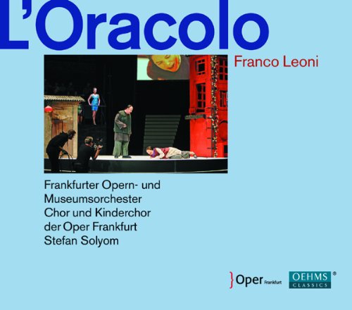 "CD cover with opera scene image, text, and logos on light blue background."