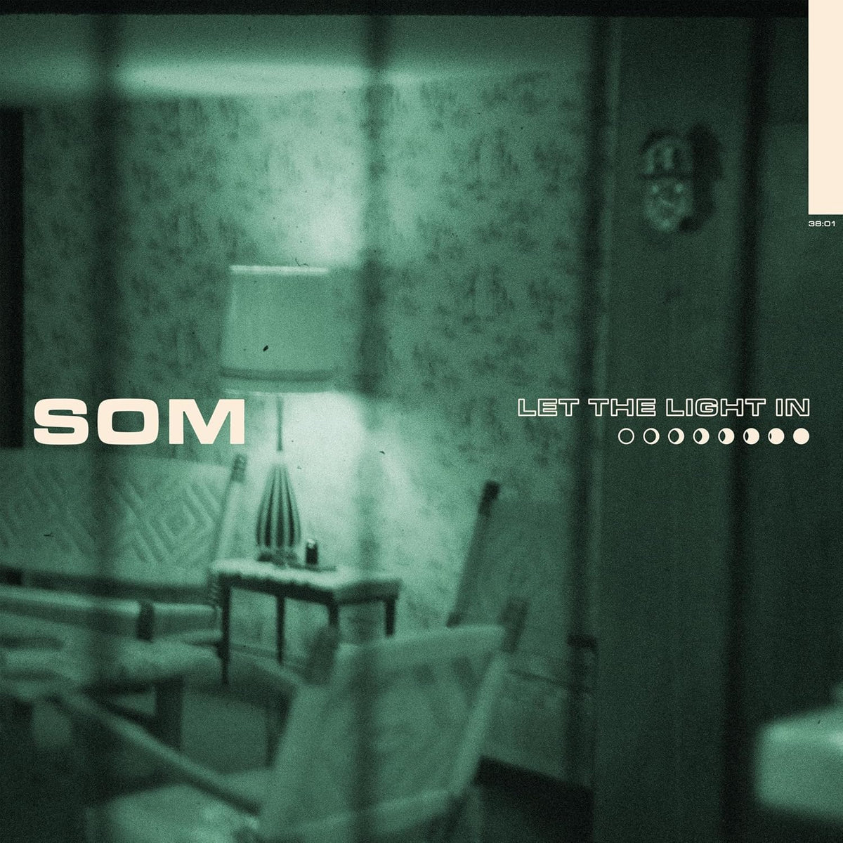 Som album cover: a dimly lit room seen through a grainy filter.