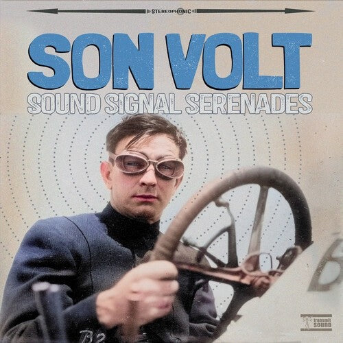 Son Volt album cover featuring a man with sunglasses and a steering wheel.