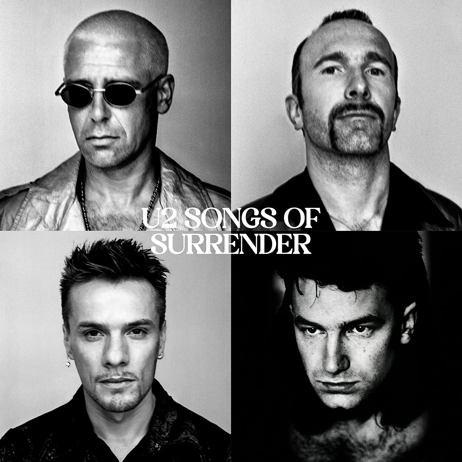 "Black and white album cover featuring four close-up portraits of U2 band members."
