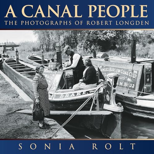 Black and white photo of people on and beside narrowboats on a canal.