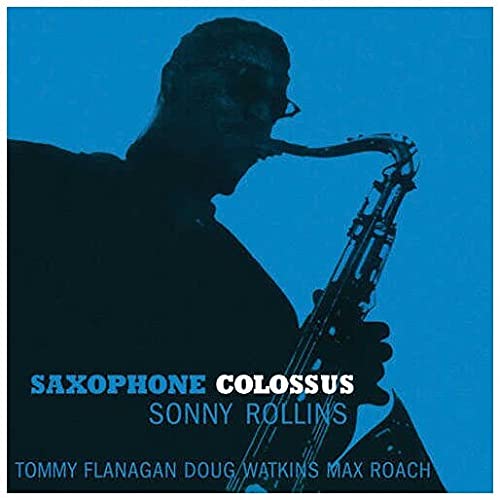 Silhouette of Sonny Rollins playing saxophone against a blue background on album cover.