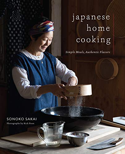 Cookbook cover featuring a woman sifting flour into a large pan.