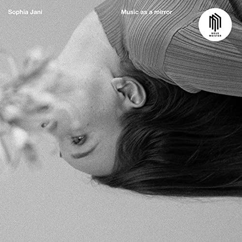 Black and white album cover featuring a person lying down, face visible.