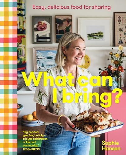 Cookbook cover featuring a smiling woman holding a tray of pastries.