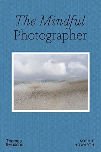 Book cover with blue textured background, title text, and a photo of animal fur.