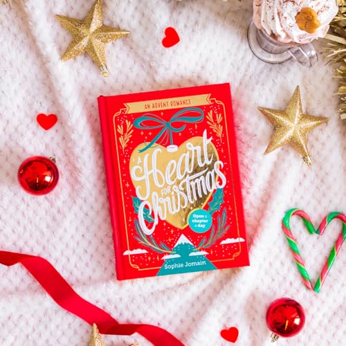 Red book titled "A Heart For Christmas" surrounded by festive decorations.